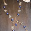 https://www.onemoregift.co.uk/product/scottish-seaglass-white- cobalt-blue -foiled- beads-knotted-waxed-cord-necklace/