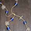 https://www.onemoregift.co.uk/product/scottish-seaglass-white- cobalt-blue -foiled- beads-knotted-waxed-cord-necklace/