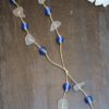 https://www.onemoregift.co.uk/product/scottish-seaglass-white- cobalt-blue -foiled- beads-knotted-waxed-cord-necklace/