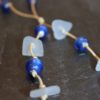 https://www.onemoregift.co.uk/product/scottish-seaglass-white- cobalt-blue -foiled- beads-knotted-waxed-cord-necklace/