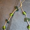 https://www.onemoregift.co.uk/product/scottish-seaglass-olive- green -foiled-glass- beads-knotted-waxed-cord-necklace/