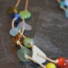 https://www.onemoregift.co.uk/product/scottish-seaglass-mixed-boho- beads-knotted-waxed-cord-necklace/