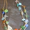 https://www.onemoregift.co.uk/product/scottish-seaglass-mixed-boho- beads-knotted-waxed-cord-necklace/