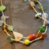 https://www.onemoregift.co.uk/product/scottish-seaglass-mixed-boho- beads-knotted-waxed-cord-necklace/