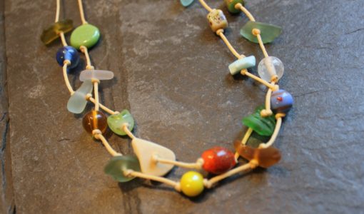 https://www.onemoregift.co.uk/product/scottish-seaglass-mixed-boho- beads-knotted-waxed-cord-necklace/