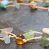 https://www.onemoregift.co.uk/product/scottish-seaglass-mixed-boho- beads-knotted-waxed-cord-necklace/