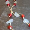 https://www.onemoregift.co.uk/product/scottish-seaglass-white- red -foiled- beads-knotted-waxed-cord-necklace/