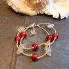 https://www.onemoregift.co.uk/product/scottish-seaglass-white- red -foiled- beads-knotted-waxed-cord-bracelet/